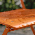 SUNDSÖ Table and 2 folding chairs, outdoor bright orange/bright orange, 65x65 cm