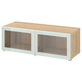 BESTÅ Shelf unit with glass doors, white stained oak effect Glassvik/white/light green clear glass, 120x42x38 cm